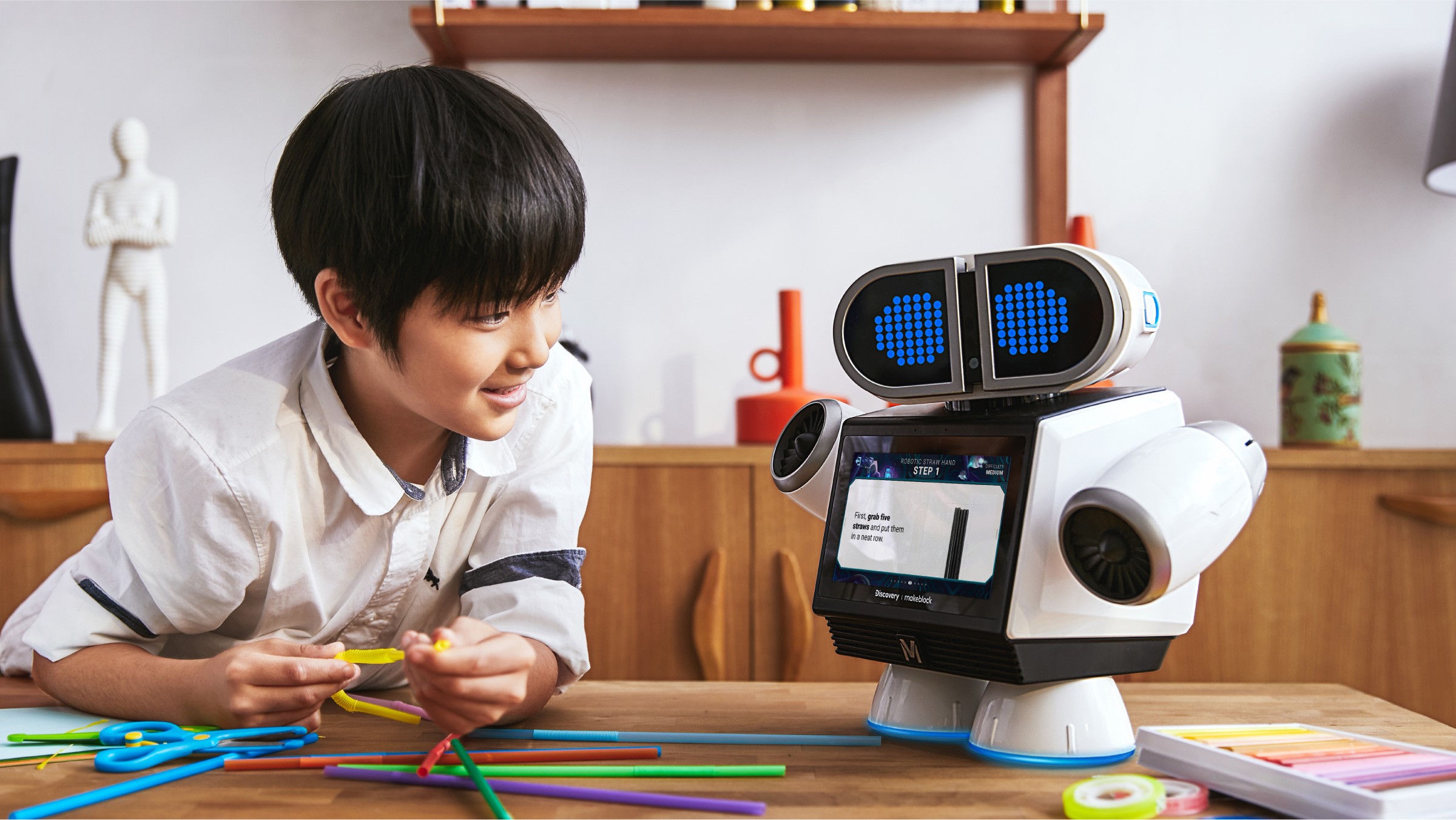 Interactive AI educational robots featuring LED eyes, interacting with kid